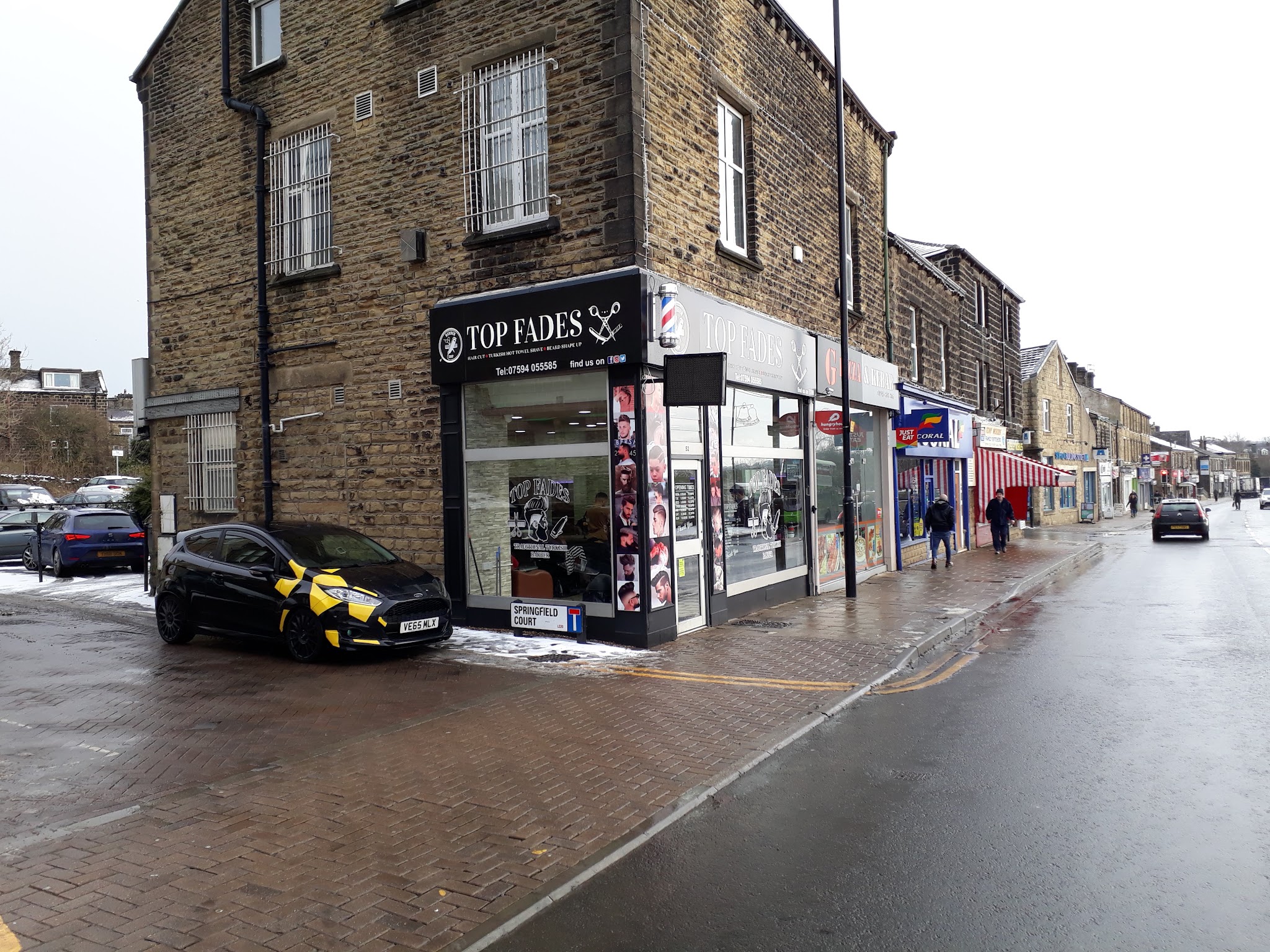 Wide view of Top Fades at 52 Otley Road, on the corner of Springfield Court in Guiseley