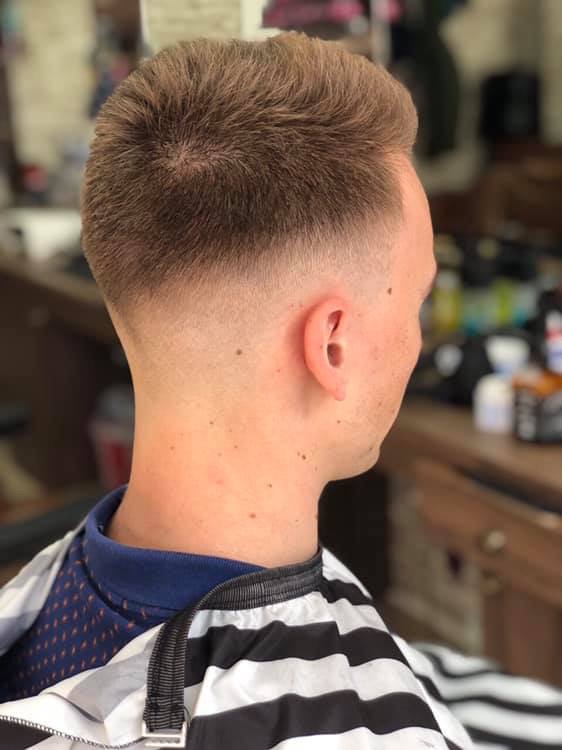 Finished fade with a textured top, photographed in the Top Fades barber chair